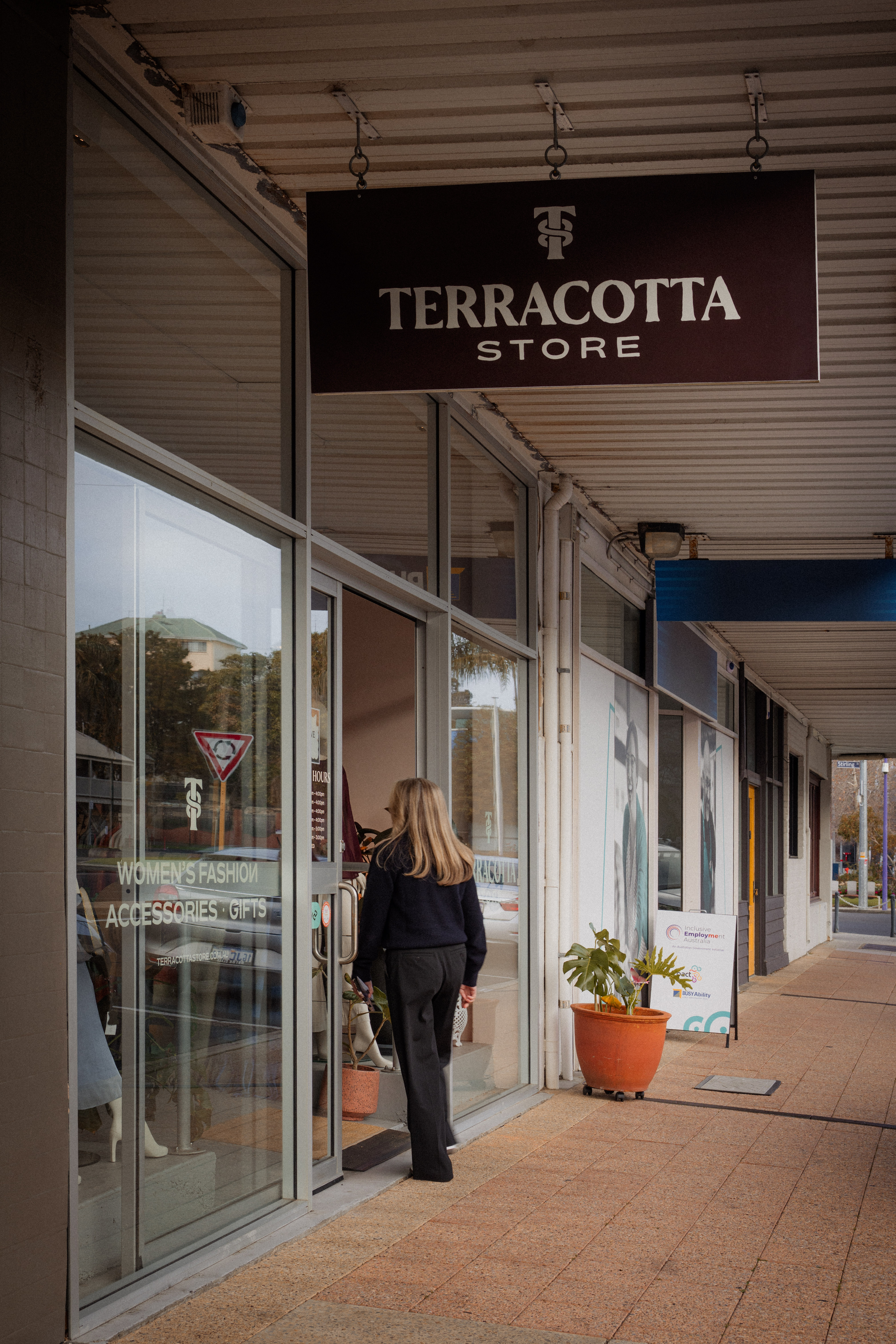 Terracotta Store hanging sign under the shopfront awning