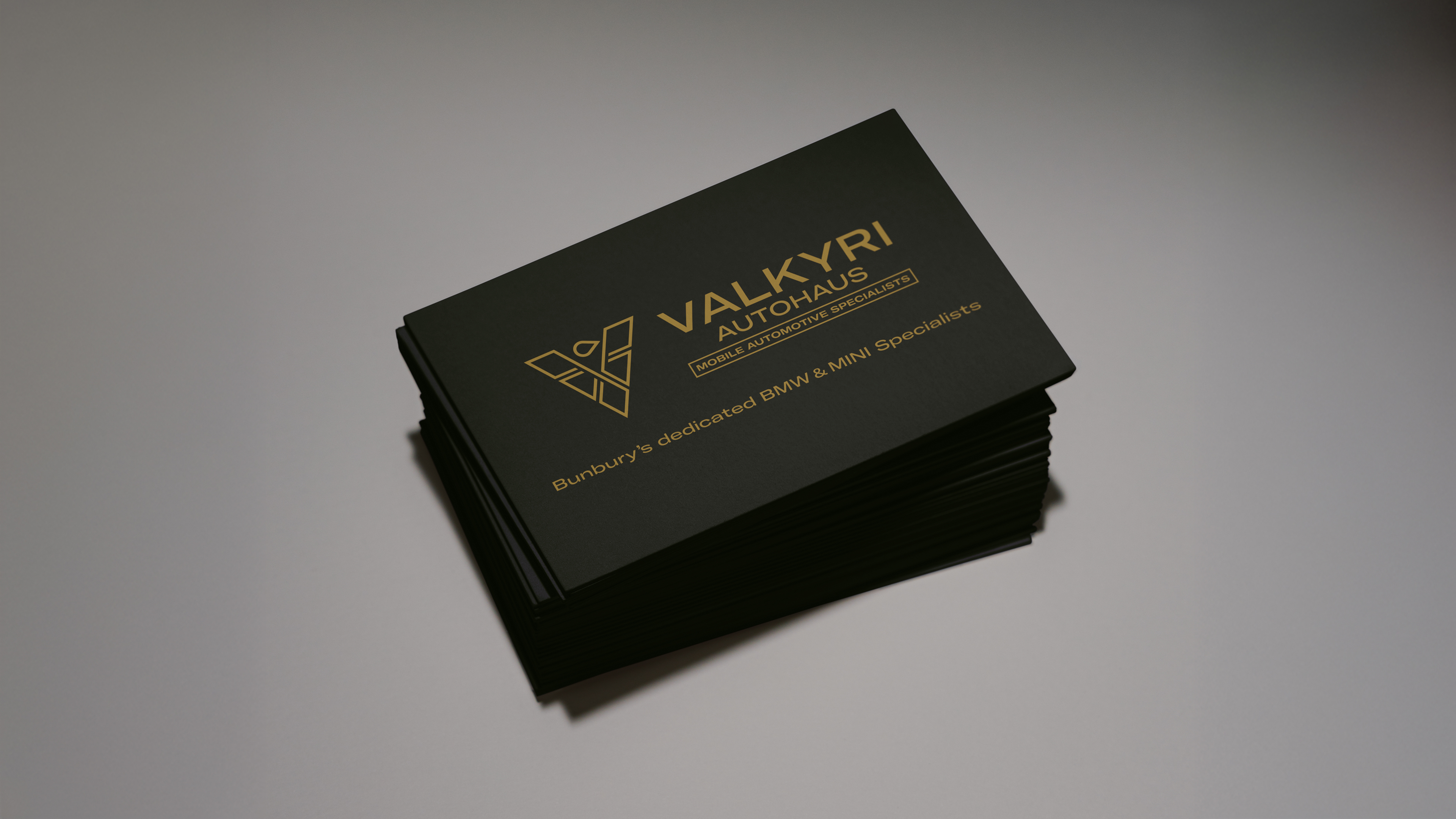 Valkyri Autohaus business cards in black and gold